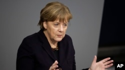 German Chancellor Angela Merkel delivers a speech at the German parliament Bundestag in Berlin, Feb. 17, 2016. 