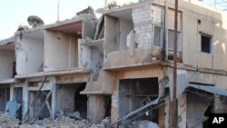 Shops and homes are seen after they were reportedly destroyed by Syrian government shelling in Rastan town in Homs province, central Syria, March 20, 2012. 