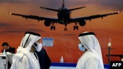 FILE - Visitors tour the Airport Show in Dubai on May 24, 2021. Dubai International Airport, the world's busiest for international travel, announced Tuesday it served 41.6 million passengers in the first half of this year