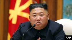 Kim Jong Un saat menghadiri rapat Komite Pusat Partai Pekerja Korea di Pyongyang, 11 April 2020. (Foto: KCNA via AFP)