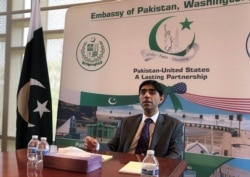 FILE - Moeed Yusuf, Pakistan's national security advisor, speaks to reporters at the Pakistani embassy in Washington on Aug. 4, 2021, after a week of meetings with U.S. officials.