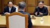 Kim Yong Chol, left, sits next to North Korean leader Kim Jong Un during talks with South Korean President Moon Jae-in during their summit at the truce village of Panmunjom, North Korea, May 26, 2018.