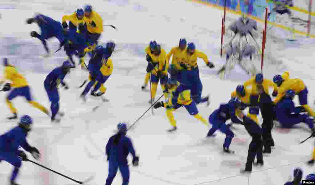 Players from the Swedish women's national ice hockey team take part in a training session at the Shayba Arena in preparation for the 2014 Sochi Winter Olympics, Feb. 4, 2014.