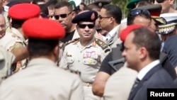 Egyptian Army Chief, General Abdel Fattah el-Sissi (C), is seen in Cairo's Nasr City district in this September 20, 2013, file photo.