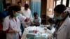 A patient has his blood taken to be tested at a fever clinic especially set up to cater to those suffering from fever, one of the main symptoms of several mosquito-borne diseases such as dengue, at a hospital in New Delhi, India, Sept. 15, 2016. The World