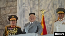 North Korean leader Kim Jong Un reacts as he attends a parade to mark the 75th anniversary of the founding of the ruling Workers' Party of Korea, in this image released by North Korea's Central News Agency on October 10, 2020.