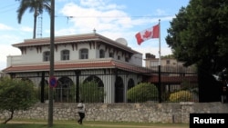 A woman walks in front of the Canada's Embassy in Havana, Cuba, Jan. 30, 2019. 