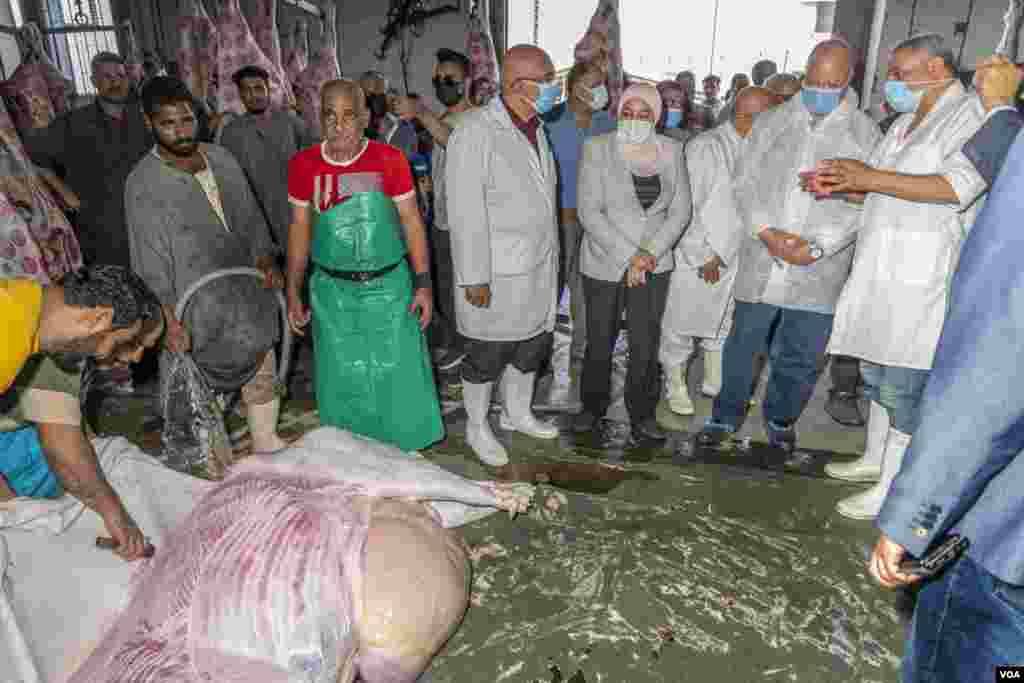 Khaled Abdel Aal (2nd from right), the governor of Cairo, visits one of the government slaughterhouses, which are now the only legal places to slaughter animals in Cairo, on July 17, 2021.