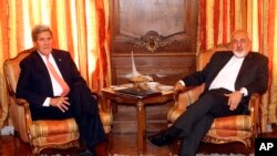 U.S. Secretary of State John Kerry, left, meets with Iran's Foreign Minister Mohammad Javad Zarif, April 27, 2015, in New York.