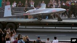 FILE - A Turkish-made Bayraktar TB2 drone is seen during a rehearsal of a military parade dedicated to Independence Day in Kyiv, Ukraine, Aug. 20, 2021. 