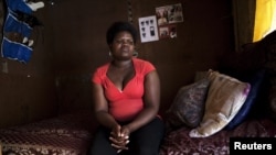 Fumana Ntontlo, 30, who says she was raped at age eight by a family member, sits in her one-room shack in Cape Town's Khayelitsha township. (file photo) 