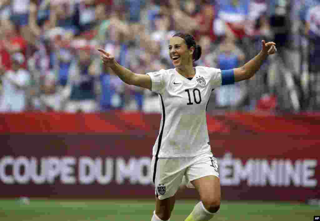 United States' Carli Lloyd celebrates after scoring her third goal against Japan during the first half of the FIFA Women's World Cup soccer championship in Vancouver, British Columbia, July 5, 2015.
