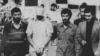 FILE - An American hostage is paraded before a crowd outside the U.S. Embassy in Tehran on Nov. 9, 1979. 