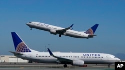 FILE - United Airlines airplanes are seen at San Francisco International Airport in San Francisco, Oct. 15, 2020.