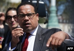U.S. Rep. Keith Ellison (D-MN) (R) speaks during a news conference in front of the Supreme Court April 13, 2016 in Washington, DC.
