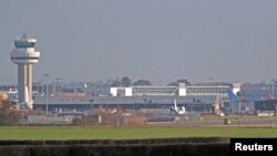 A police vehicle stands on the closed runway at Gatwick Airport after drones flying illegally over the airfield forced the closure of the airport, in Gatwick, Britain, Dec. 20, 2018.