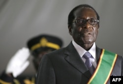 Zimbabwean President Robert Mugabe is hastily sworn in for a sixth term in office in Harare, on June 29, 2008 after being declared the winner of a one-man election. The 84-year-old veteran was boycotted by opposition leader and first-round winner Morgan T