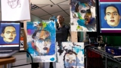 Humanoid robot Sophia, developed by Hanson Robotics, is reflected in a mirror between paintings before auctioning her own non-fungible token (NFT) artwork, in Hong Kong, China March 16, 2021. REUTERS/Tyrone Siu