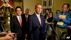House Majority Leader Rep. Eric Cantor, R-Va., left, looks on as Speaker of the House Rep. John Boehner, R-Ohio, pauses during a news conference on Capitol Hill, Oct. 1, 2013.