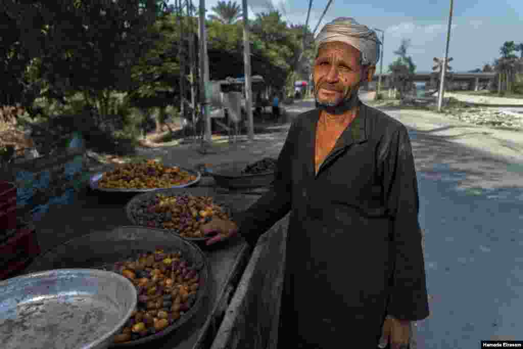 "This year, the dates are not as sweet as they used to be, and they go bad quickly," says Farhan, 58, a father of seven who has been cultivating and trading the fruit for more than 45 years, in Cairo, September 9, 2021. (VOA/Hamada Elrasam)