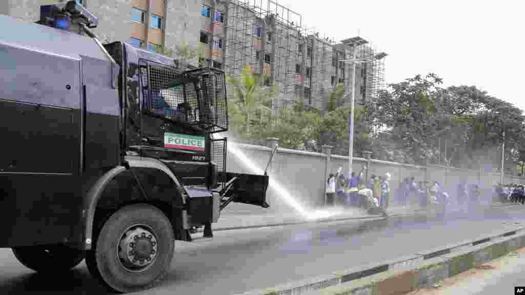 A police water cannon disperses women demonstrators as they try to march to the town center, in the Ngagara district of Bujumbura, Burundi, May 13, 2015.