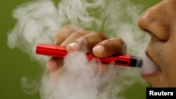 A man uses a vape device in this illustration picture, September 19, 2019.