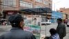 FILE - A man looks at newspapers, following Bolivia's former president Evo Morales' exit out of the country, in La Paz, Bolivia, Nov. 12, 2019.