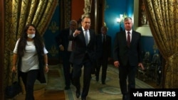 Russian Foreign Minister Sergei Lavrov and U.S. Deputy Secretary of State Stephen Biegun walk during their meeting in Moscow, Russia, Aug. 25, 2020. (Russian Foreign Ministry/Handout via Reuters)