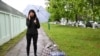 Katerina Borisevich, a journalist for the independent news outlet Tut.by, speaks on the phone after being released from a prison in Gomel, Belarus, May 19, 2021.