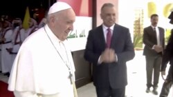 Iraqi Prime Minister Mustafa Al-Kadhimi welcomes Pope Francis at Baghdad International Airport to start his historic tour in Baghdad, Iraq, March 5, 2021.