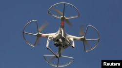 FILE - A drone is seen flying in Shenzhen, China, Dec. 18, 2015. A boom in consumer drone sales has spawned a counter-industry of start-ups aiming to stop drones from flying where they shouldn't.