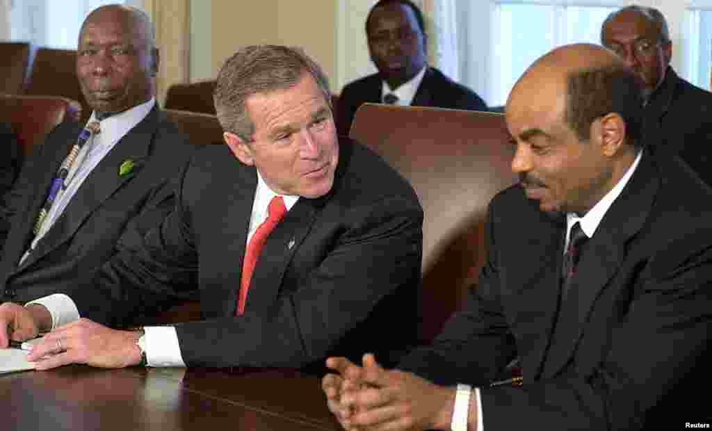 U.S. President George W. Bush chats with Meles during a meeting with Kenyan President Daniel Arap Moi for talks on combatting international terrorism, the White House, Washington, December 5, 2002.