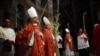 Christian clergymen carry palm fronds during the Palm Sunday procession in the Church of the Holy Sepulcher, traditionally believed by many to be the site of the crucifixion, in Jerusalem's Old City, March 20, 2016.