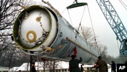 FILE - Soldiers prepare to destroy a ballistic SS-19 missile in the yard of the largest former Soviet military rocket base in Vakulenchuk, Ukraine, Dec. 24, 1997. Trump administration officials say the U.S. sees value in the New START arms control agreement.