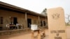 FILE - A sign for Ghana's Electoral Commission is seen at a polling station in Accra, Jan. 2, 2009.