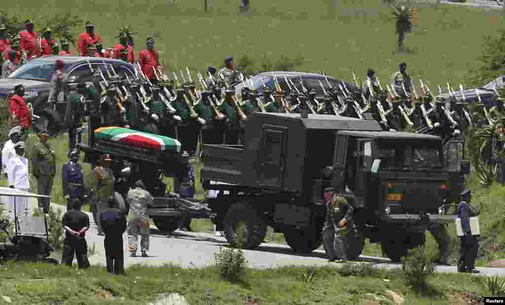 Former South African President Nelson Mandela's coffin arrives at the family gravesite for burial at his ancestral village of Qunu in the Eastern Cape province, 900 km (559 miles) south of Johannesburg.