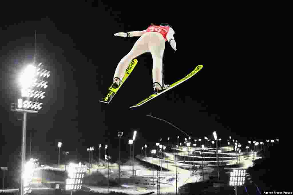 Slovenia's Ursa Bogataj practices during the Ski Jumping Women's Normal Hill official training 1, at the Zhangjiakou National Ski Jumping Center ahead of the Beijing 2022 Winter Olympic Games.