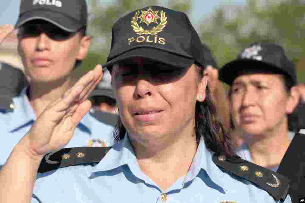 A colleague cries as friends carry the coffin of a police officer killed during a failed military coup last Friday, during his funeral at Kocatepe Mosque in Ankara, Turkey, July 17, 2016.