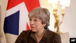 British Prime Minister Theresa May calls President Donald Trump's retweeting of anti-Muslim videos "wrong."