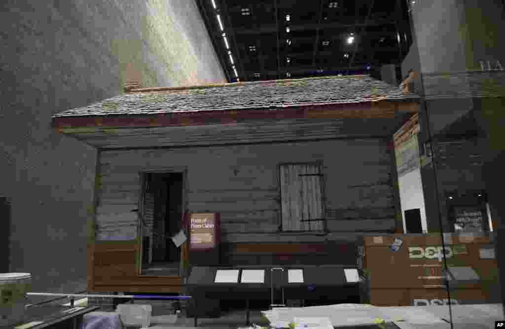 A slave cabin from the Point of Pines Plantation is on display at the National Museum of African American History and Culture in Washington, Sept. 14, 2016.