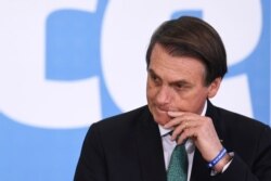 Brazilian President Jair Bolsonaro gestures during a ceremony to announce measures to stimulate the economy at Planalto Palace in Brasilia, July 24, 2019.
