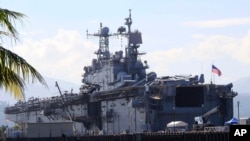The amphibious assault ship USS Peleliu, which took part in the joint military exercise with their Philippine counterpart, is docked at the Alava pier, off Subic Bay Freeport zone in Zambales province, northwestern Philippines, Oct. 13, 2014. 