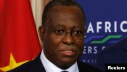 FILE - Vice President of Angola Manuel Vicente at the State Department in Washington, Aug. 4, 2014. Vicente is suspected of bribing a Portuguese magistrate to favor him in two investigations, a statement said. It said Vicente was at the time of the alleged crimes the head of Angolan state oil company Sonangol.