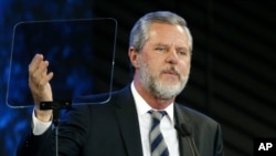 FILE - Jerry Falwell Jr. speaks before a convocation at Liberty University in Lynchburg, Va., Nov. 28, 2018.