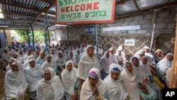 Members of Ethiopia's Jewish community gather to protest the Israeli government's decision not to allow all of them to emigrate to Israel, at the synagogue in Addis Ababa, Nov. 19, 2018.