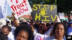 Civil rights activists march at the start of the 21st International AIDS Conference in Durban, South Africa, July 18, 2016. Some clerics seek a less judgmental approach in battling the epidemic, which often afflicts people who are gay.