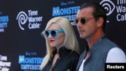 FILE - Musician Gwen Stefani (L) and her husband singer Gavin Rossdale pose at the premiere of the film "Monsters University" at El Capitan theater in Hollywood, California.