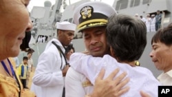 U.S. navy officer Michael "Vannak Khem" Misiewicz becomes emotional as he embraces his aunt Samrith Sokha, 72, at Cambodian coastal international sea port of Sihanoukville, file photo.