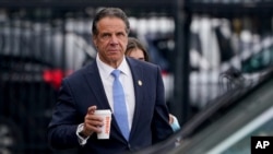 New York Gov. Andrew Cuomo prepares to board a helicopter after announcing his resignation, Aug. 10, 2021, in New York.