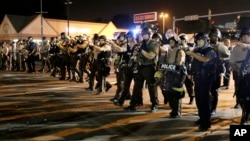 Police advance to clear the crowd, Ferguson, Missouri, Aug. 18, 2014